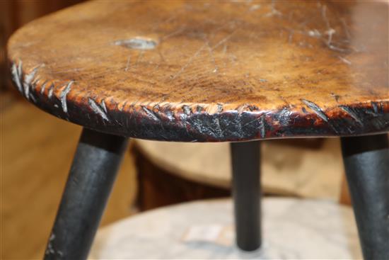 An 18th century elm primitive stool W.40cm at base